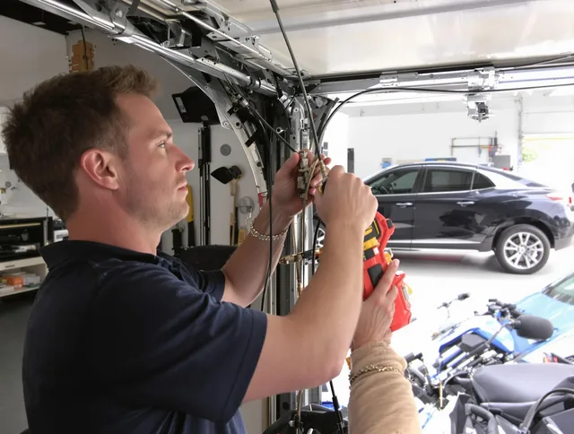 Florence-Graham Garage Door Repair safety certified technician performing cable replacement in Florence-Graham