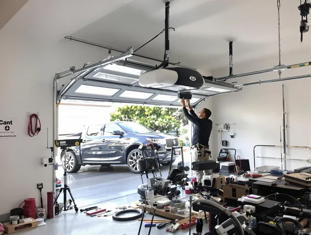 Florence-Graham Garage Door Repair specialist installing smart garage door opener system in Florence-Graham home